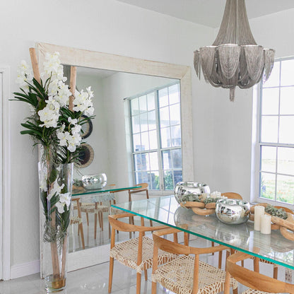 White Vanda Orchids and Driftwood Inside a Large Conical Glass Cylinder